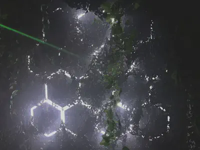 Photo of hexagonal light strips behind plastic foliage on a wall