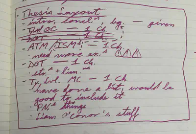 Photo of a notebook page reading &ldquo;Thesis layout&rdquo;, with a list of chapters