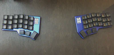 An image of the two halves of the Zen keyboard. Each half is a mirror of the other.